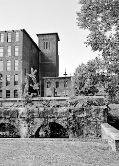 Black and white photo of a mill complex.