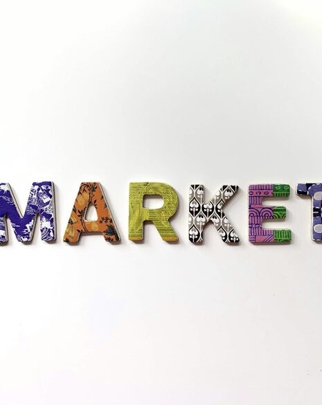 The image displays the word "MARKET" spelled out using decorative, patterned letters against a plain white background.